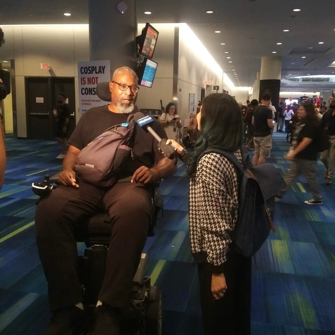 Garrick being interviewed at an event.